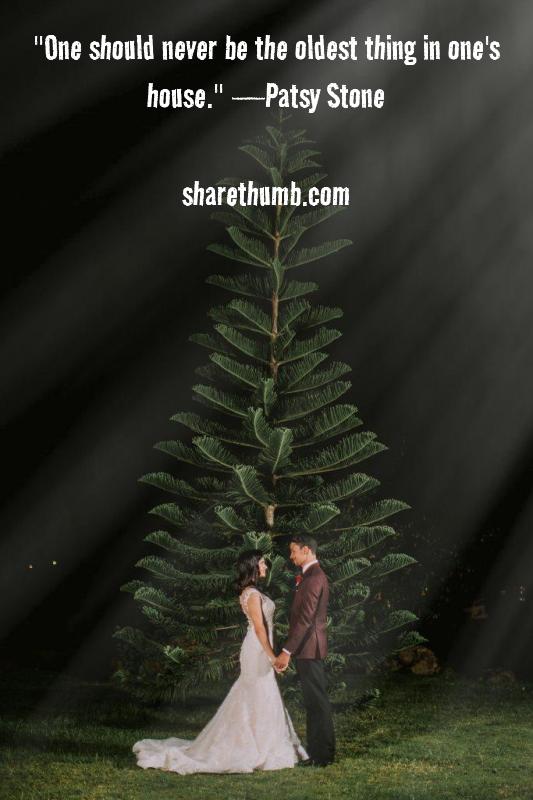 Couple stand in front of X-MAS Tree in night